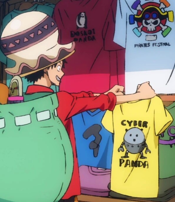 Picture of the warrior of liberation and sun god holding a Cyber Panda t-shirt